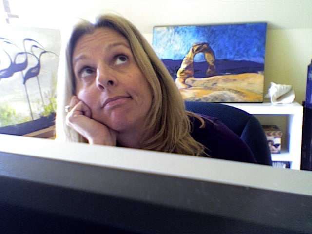 Jane at computer musing