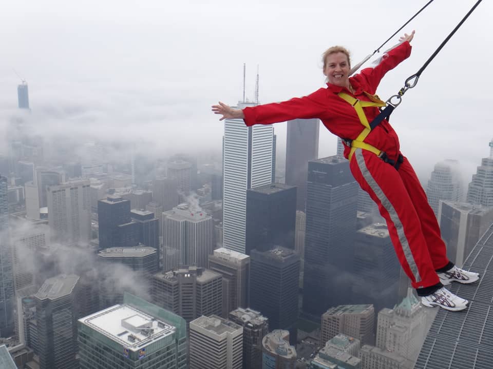 Doing the EdgeWalk on the CN Tower in Toronto.