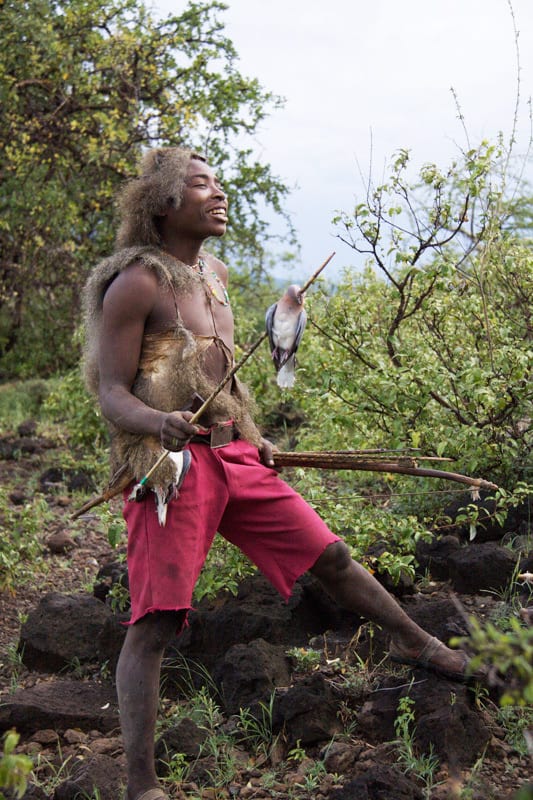 Young hunters showed off their prowess with bow and arrow while on a walk near their camp.