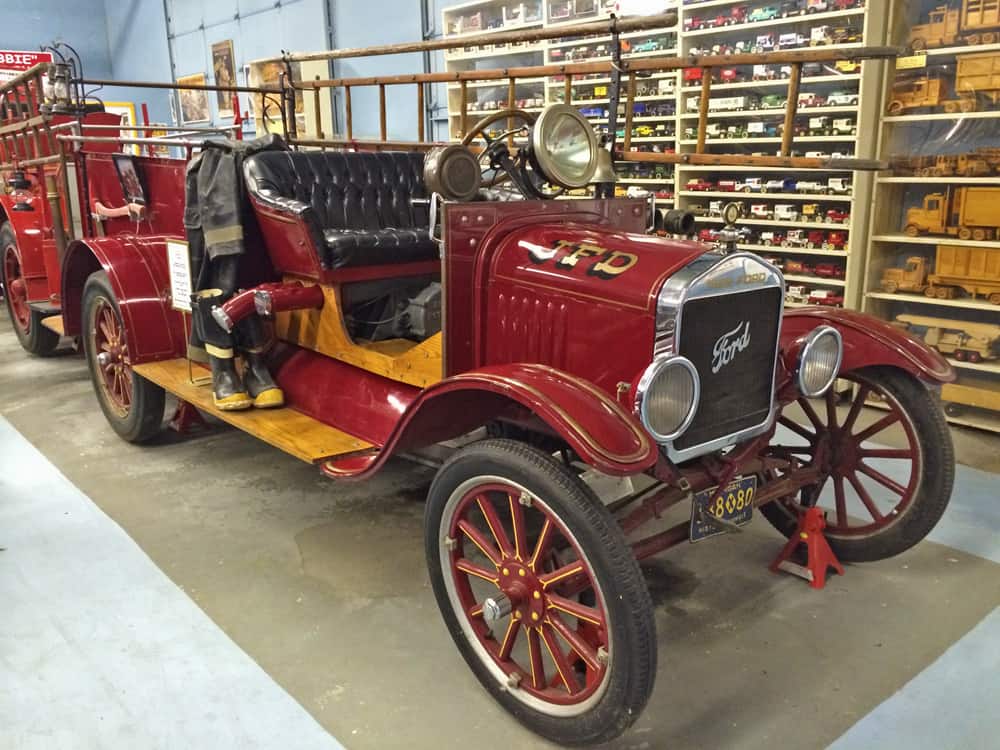 60 antique and vintage fire trucks fill garage after garage of the museum.