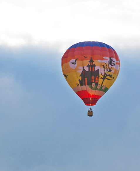 Dusk falls as the last of the balloons drifts by.