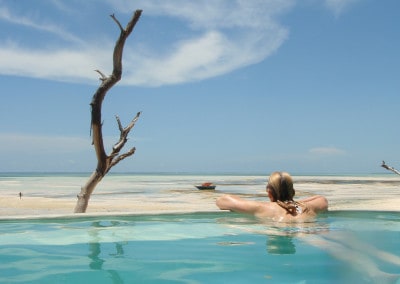 Jane on pool edge Zanzibar Pongwe Beach