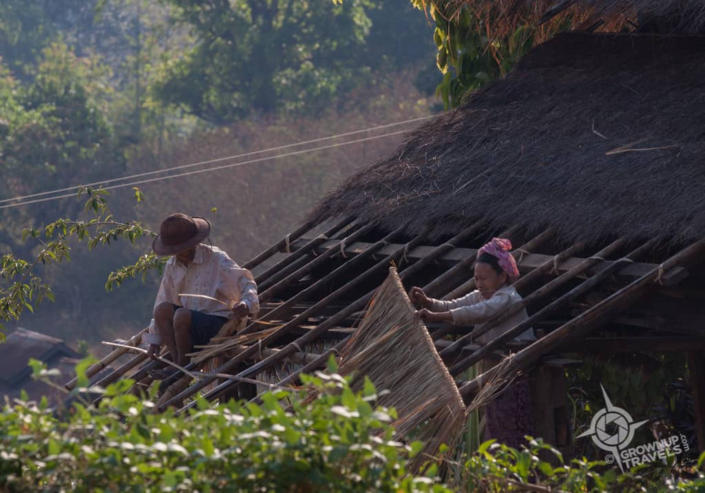 Repairing a thatch roof.