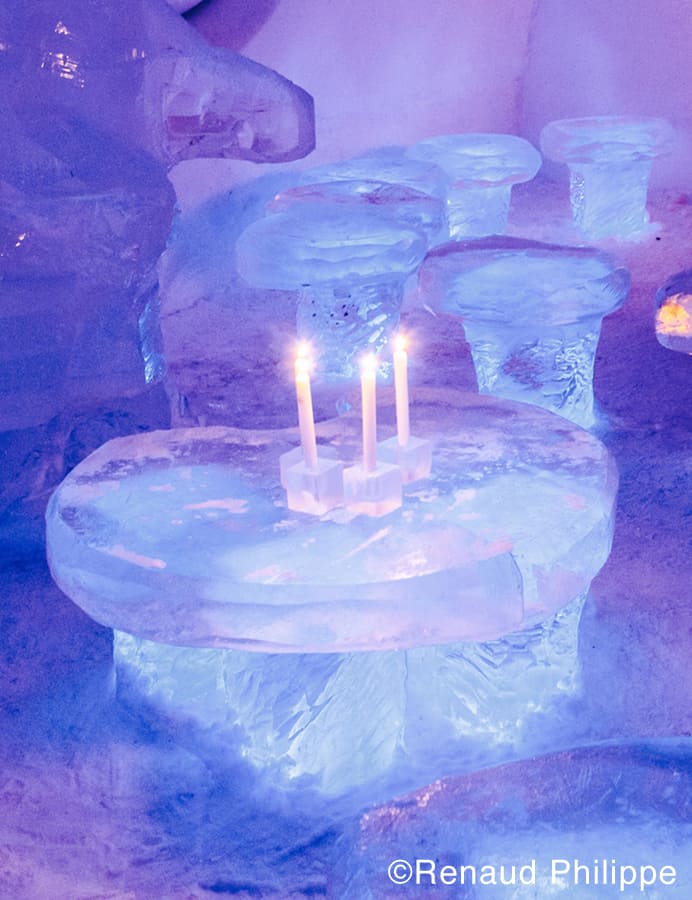 Candles lit in room at Hôtel de Glace candles-in-ice-hotel-Philippe