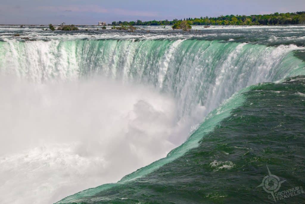 Horsehoe Falls roars over the edge