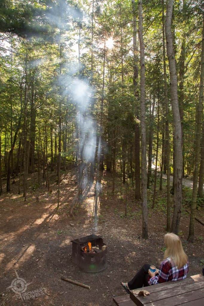 Jane at fire pit in Killarney Provincial park