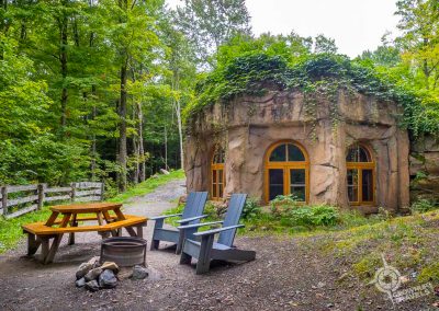 Rock House Exterior with Fire Pit