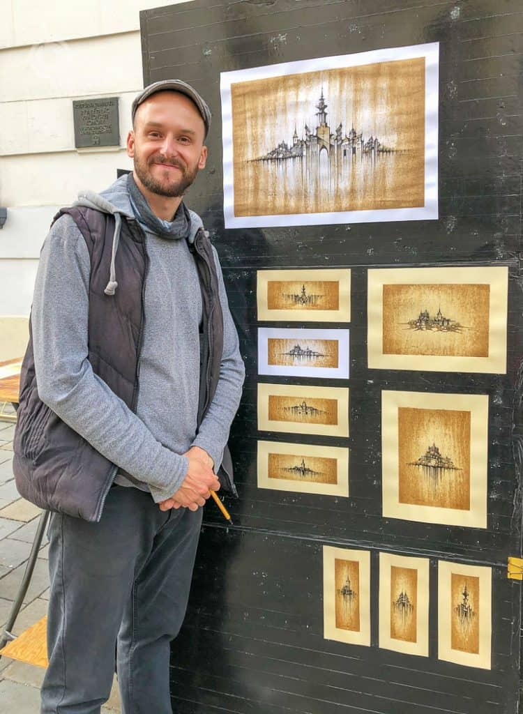 Street Artist with coffee paintings Bratislava Old Town