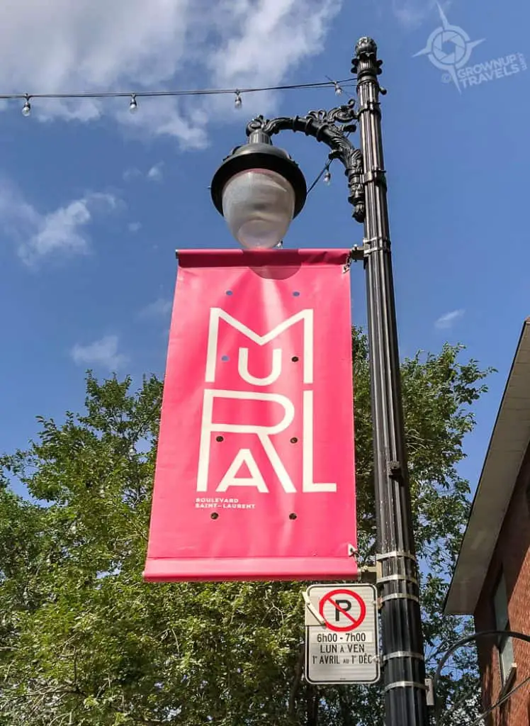 Montreal Mural Festival banner Saint Laurent Street