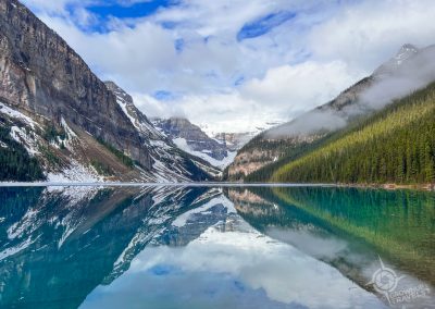 Reflections of Lake Louise perfectly calm Banff Alberta