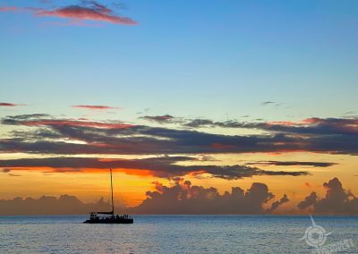 Catamaran with sunset behind St. Lucia