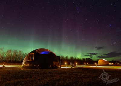 Aurora Borealis over Domes horizontal at Métis Crossing