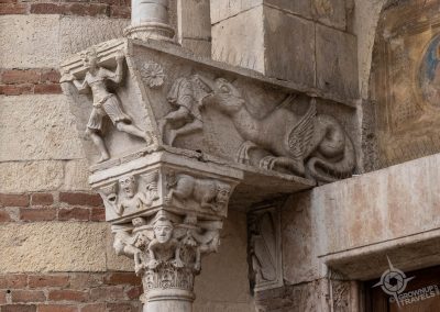 Dragon eating man detail on stone column Verona Cathedral