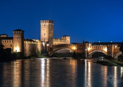 Adige River reflected in water Verona at blue hour
