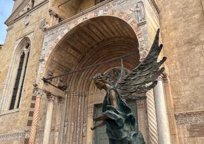 bronze angel outside Verona Cathedral