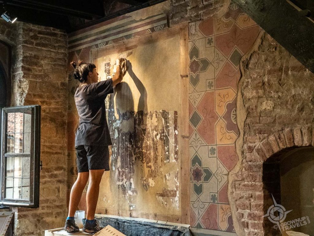 restoring frescoes inside Casa di Giulietta Verona