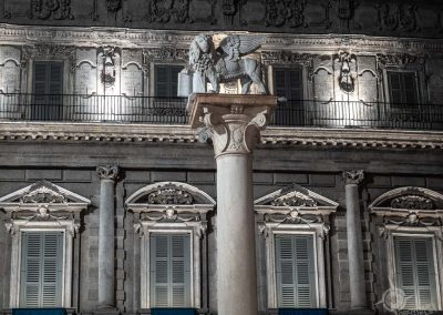 winged Venetian lion in piazza erbe verona at night