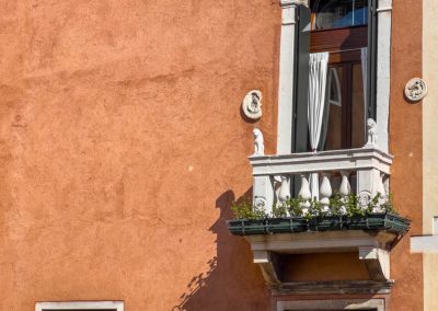 Balcony on siena coloured wall Venice