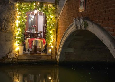 Bridge-side restaurant at night no people