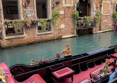 Gondola parked on colourful canal Venice-2