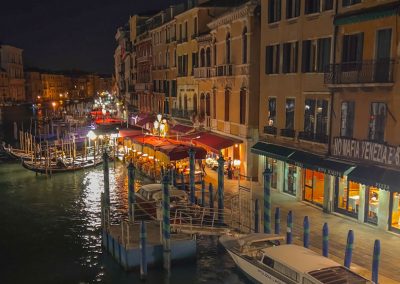 Venice at night canal views with boats and restaurants