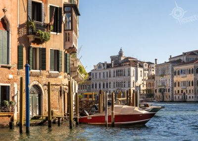 colourful Venetian buildings and boat on canal