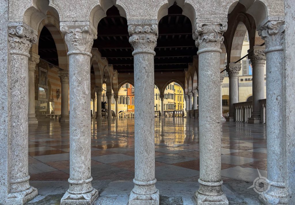 view into Loggia del Lionello through pillars Udine