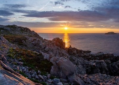 Bonavista Newfoundland sunset on rocks near lighthouse