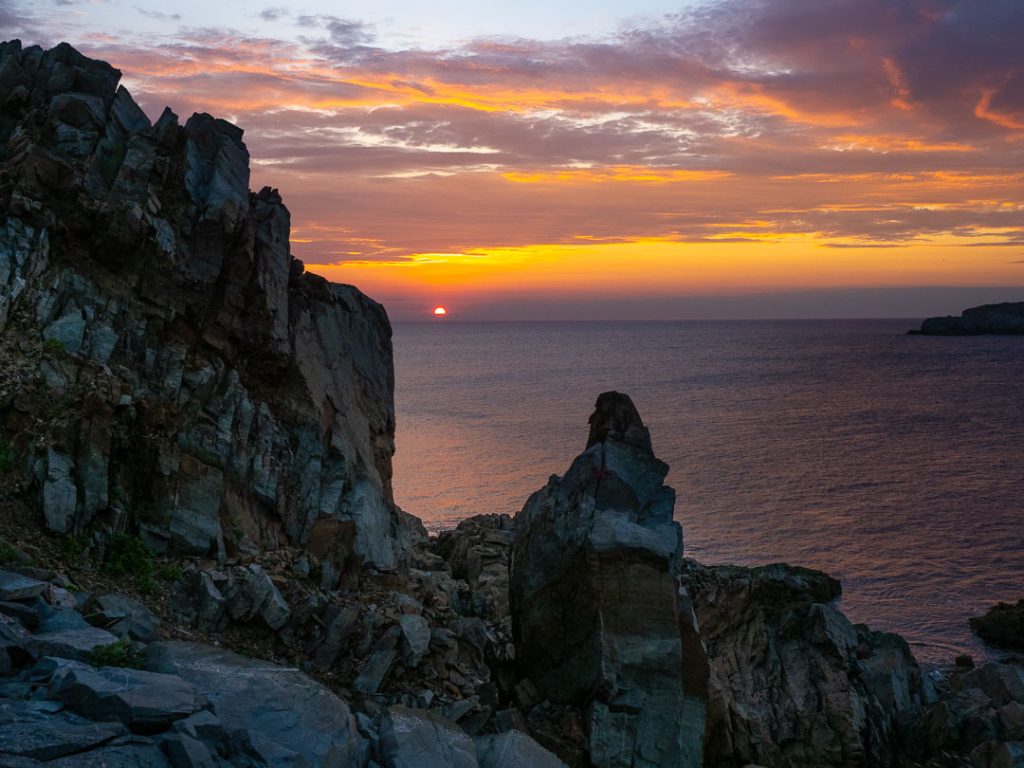 Cape Bonavista lighthouse rocks at sunset