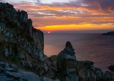 Cape Bonavista lighthouse rocks at sunset
