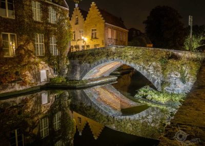 Canal bridge with reflections Bruges Belgium horiz