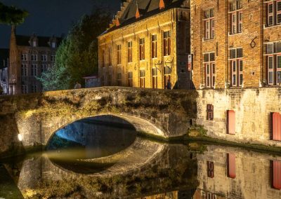 Canal bridge with reflections Bruges Belgium vert