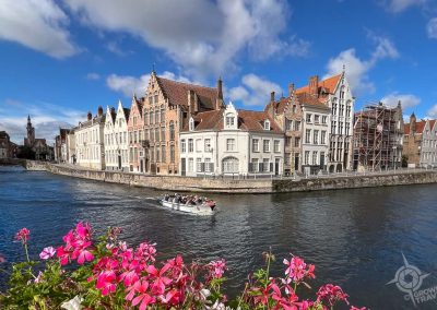 Canal houses with tour boat in Bruges Belgium