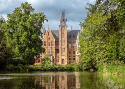 Castle Loppem with pond reflection Bruges Belgium-2