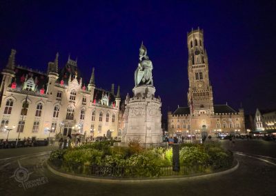 Market Square Bruges at night with statue and Belfry