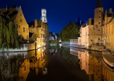 Mirrored canal in Bruges with Belfry Belgium