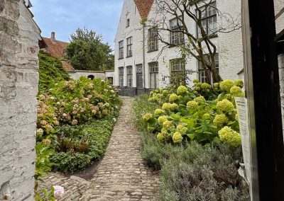 Secret garden in Begijnhof in Bruges Belgium