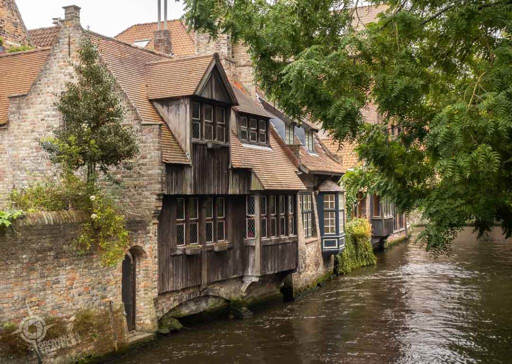 Wooden facades on canal houses near Love Bridge Bruges Belgium