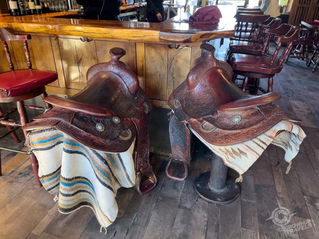 John Wayne's saddles at bar in Tubac's Golf Club