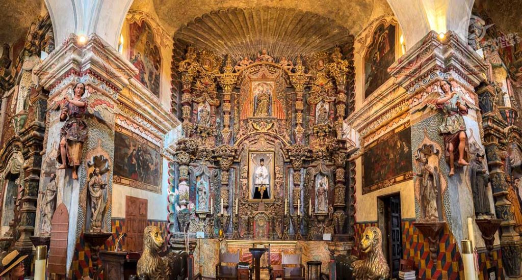San Xavier del Bac Main altar with Father Kino statue