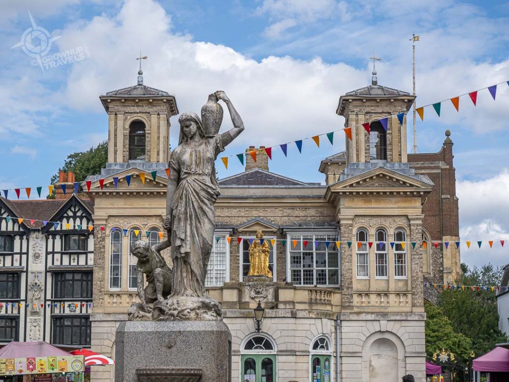 Kingston Upon Thames market with Victorian statue and gilt Queen Victoria