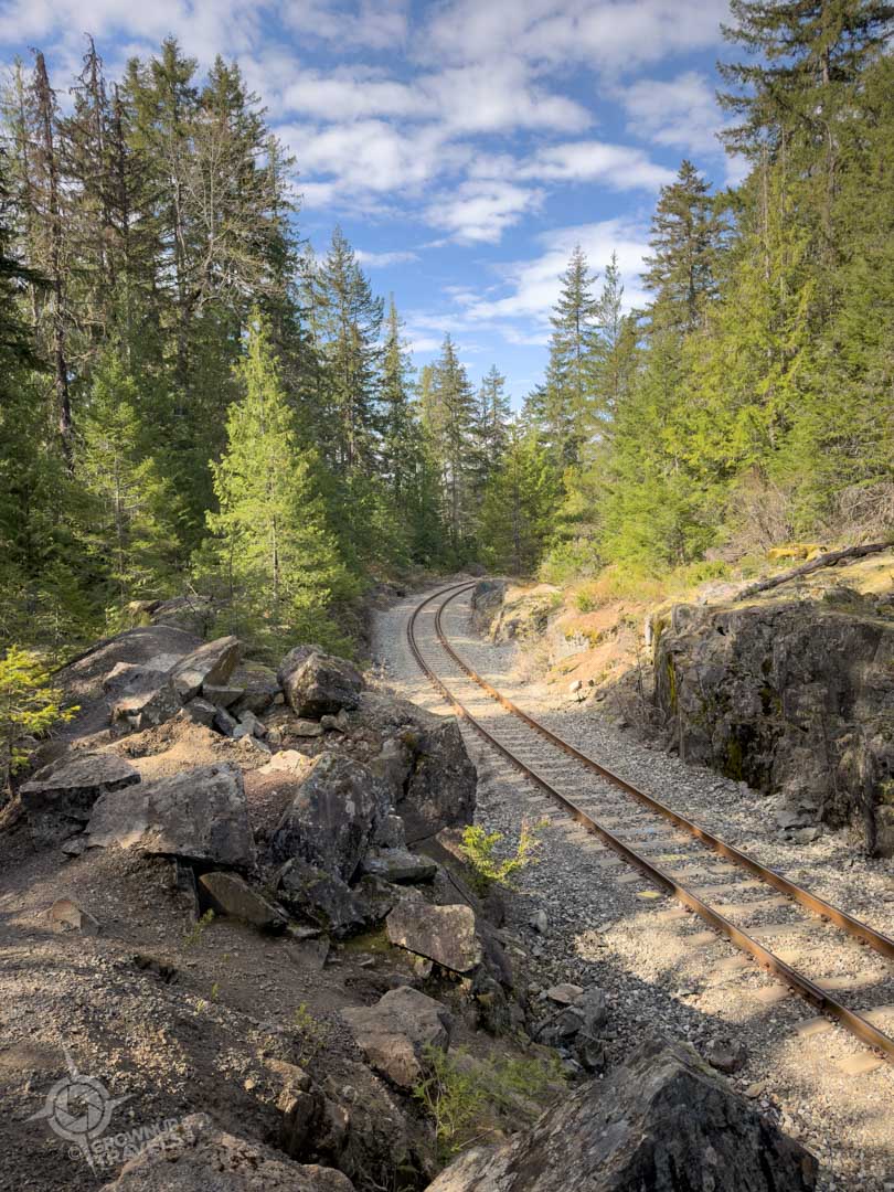Train track curve near boxcar wrecks