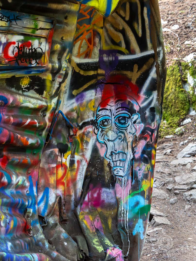 graffitied boxcar detail on Train Wreck Trail near Whistler