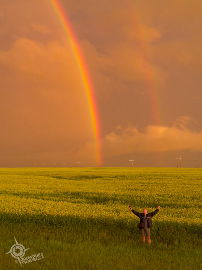 Storm Chasing Saskatchewan Henk with double rainbow over canola