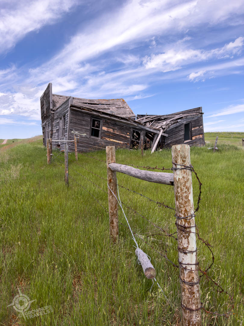 Storm Chasing Saskatchewan ruined homestead with fence