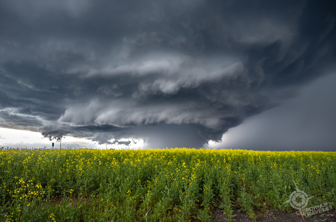Storm Chasing Saskatchewan storm cell formi g over road and field-2
