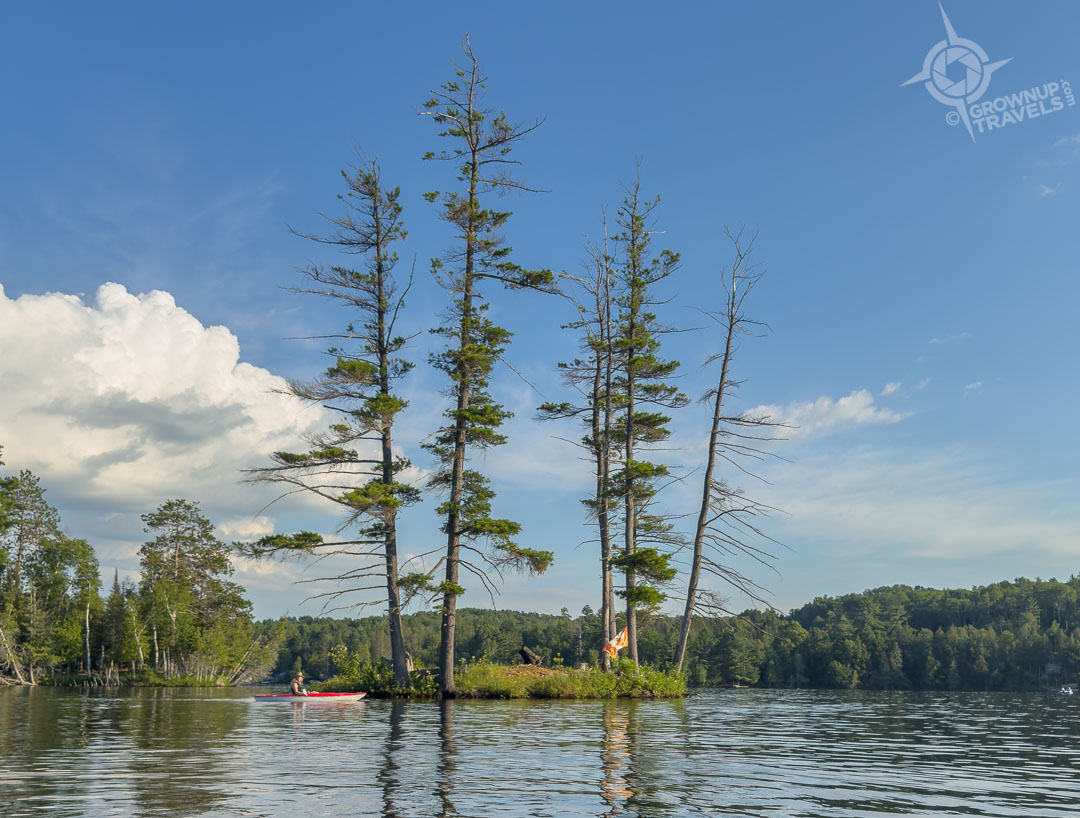 Tiny islet on lake johnson quebec with kayaker-2